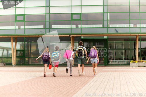 Image of group of happy elementary school students running