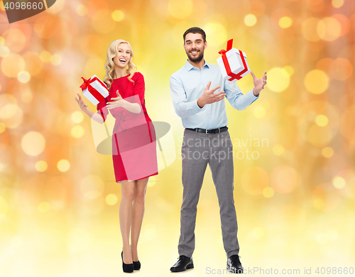 Image of happy couple with gift boxes