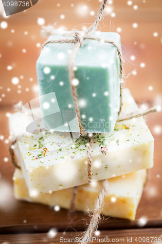 Image of close up of handmade soap bars on wood