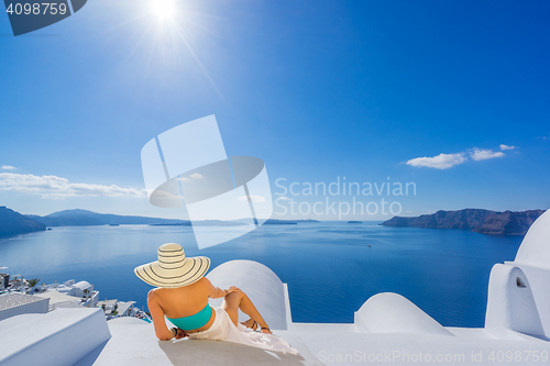 Image of Young woman on holidays, Santorini Oia town 