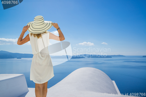 Image of Young woman on holidays, Santorini Oia town 