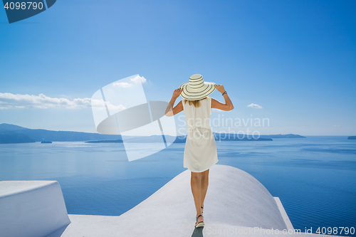 Image of Young woman on holidays, Santorini Oia town 