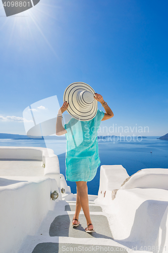 Image of Young woman on holidays, Santorini Oia town 