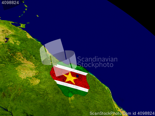Image of Suriname with flag on Earth