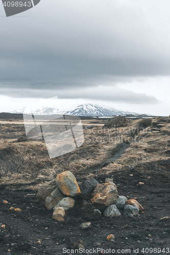 Image of Cloudy weather over a rocky landscape