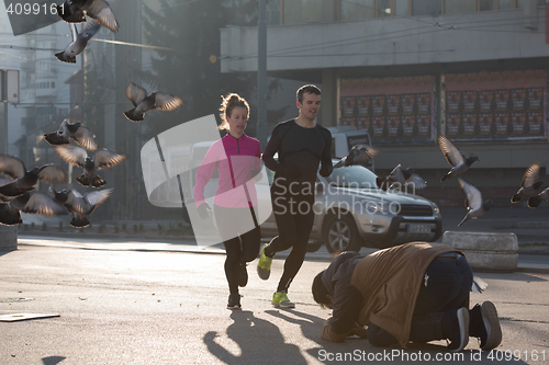 Image of young  couple jogging