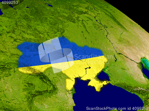 Image of Ukraine with flag on Earth