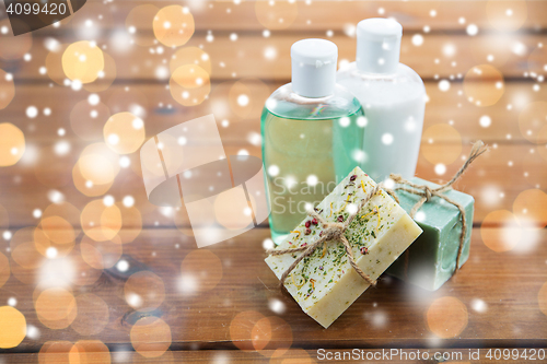 Image of handmade soap bars and lotions on wood