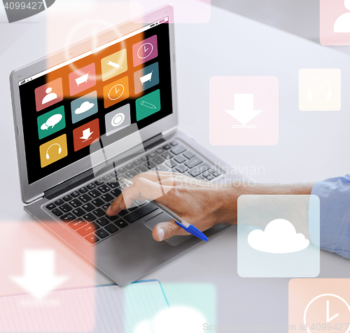 Image of businessman with laptop computer working at office