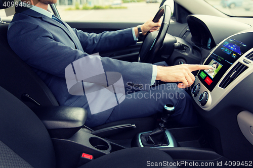 Image of close up of man driving car and incoming call