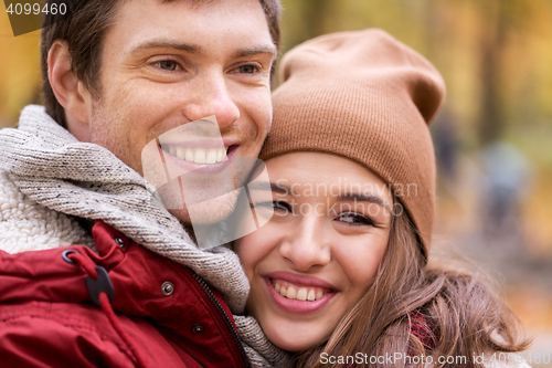 Image of close up of happy young couple in autumn park