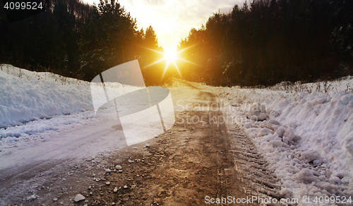 Image of winter road in rural areas at sunset