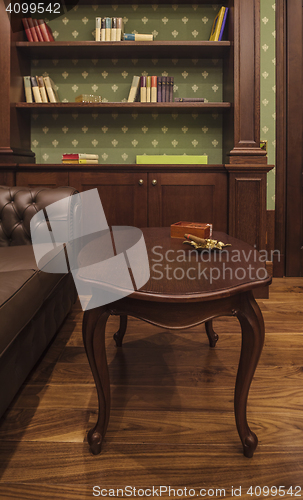 Image of cigar in cozy smoking room