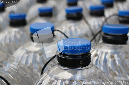 Image of  plastic bottles with blue lids 
