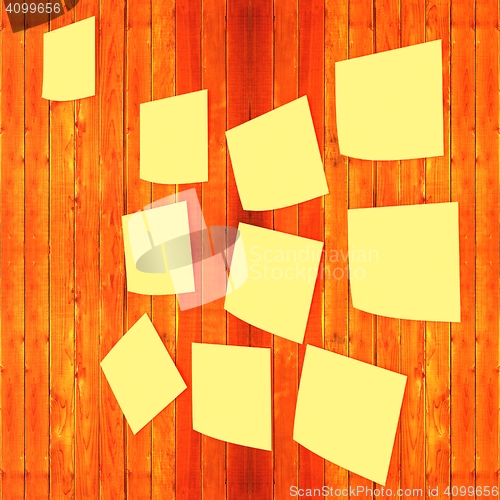 Image of Mock-up of Sticky note paper on a wooden wall. 3D illustration