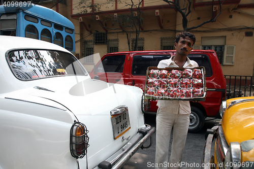 Image of Streets of Kolkata. Street vendors selling strawberries