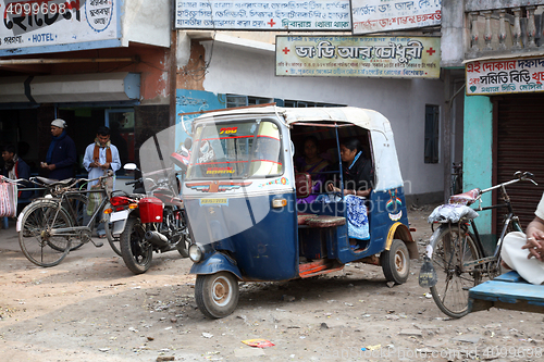 Image of Auto rickshaw taxis on a road in Kumrokhali, West Bengal, India