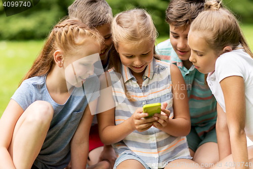 Image of kids or friends with smartphone in summer park
