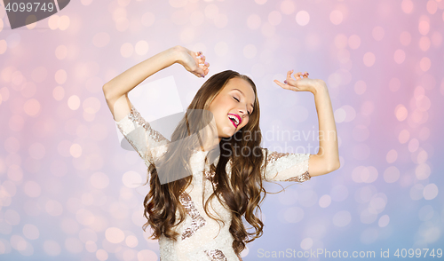 Image of happy young woman or teen girl dancing at party