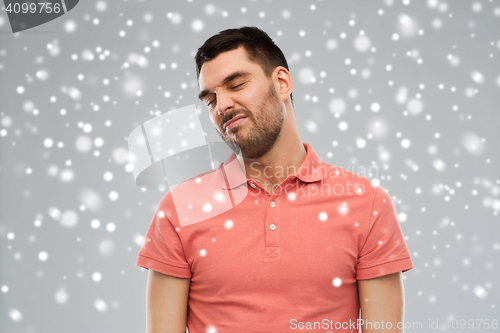 Image of man wrying over snow background