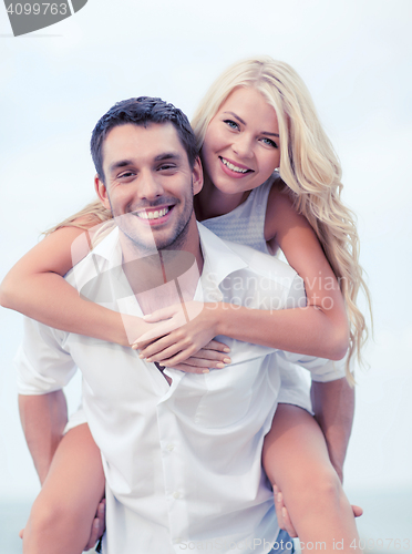 Image of couple having fun on the beach