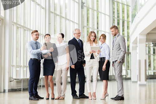 Image of business people with tablet pc computers at office