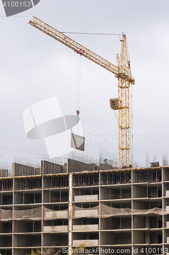 Image of Crane raised formwork on construction of multi-storey residential building