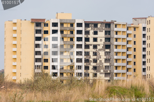 Image of A suspended illegal construction of multi-storey residential building