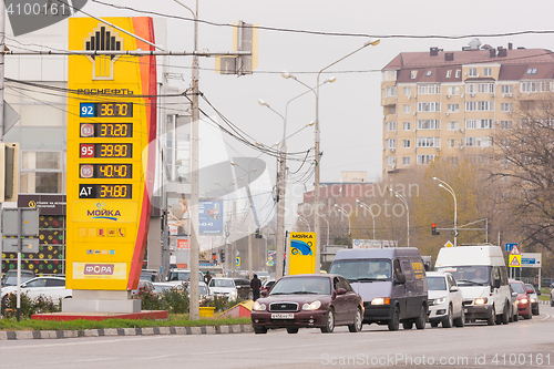 Image of Anapa, Russia - November 16, 2016: Refills Stand oil company Rosneft with prices as of November 2016 in the Krasnodar region, near cars moving on urban road