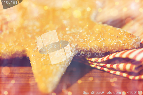 Image of close up of star gingerbread cookie and towel