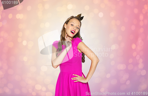 Image of happy young woman or teen girl in princess crown