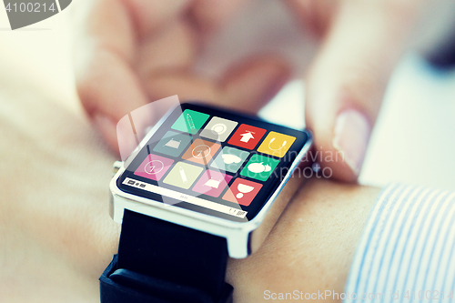 Image of close up of hands setting smart watch application
