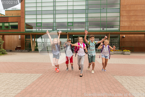 Image of group of happy elementary school students running