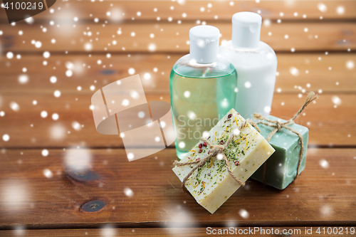 Image of handmade soap bars and lotions on wood