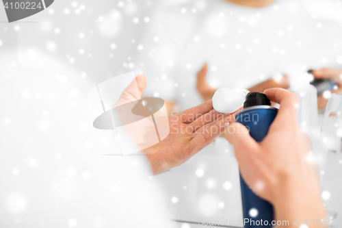 Image of close up of man with shaving foam spray