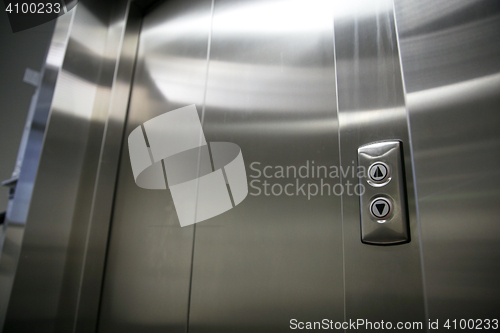 Image of elevator or lift closed metal doors and buttons