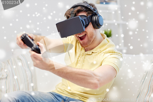 Image of man in virtual reality headset with controller