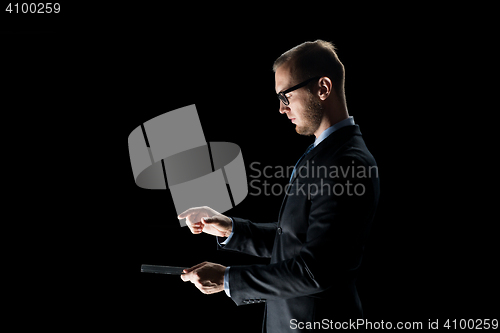 Image of close up of businessman with transparent tablet pc