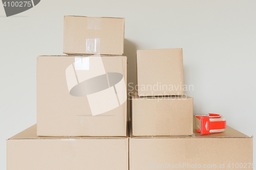 Image of Variety of Packed Moving Boxes In Empty Room