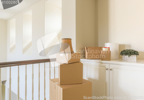 Image of Variety of Packed Moving Boxes In Empty Room