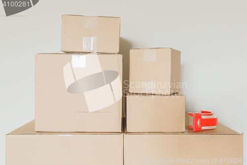 Image of Variety of Packed Moving Boxes In Empty Room