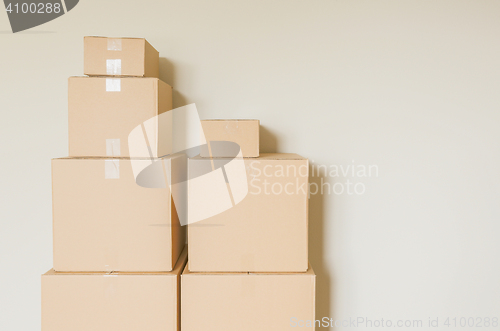 Image of Packed Moving Boxes In Empty Room