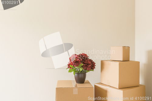 Image of Variety of Packed Moving Boxes In Empty Room