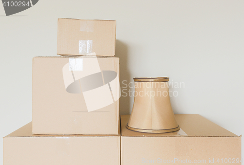 Image of Variety of Packed Moving Boxes In Empty Room