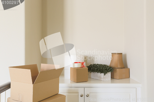 Image of Variety of Packed Moving Boxes In Empty Room