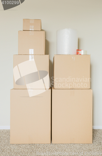 Image of Variety of Packed Moving Boxes In Empty Room