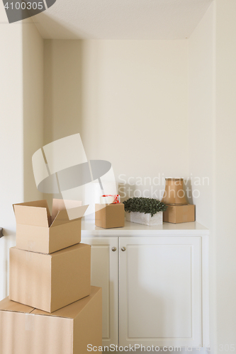 Image of Variety of Packed Moving Boxes In Empty Room