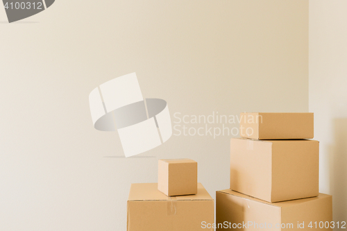 Image of Packed Moving Boxes In Empty Room