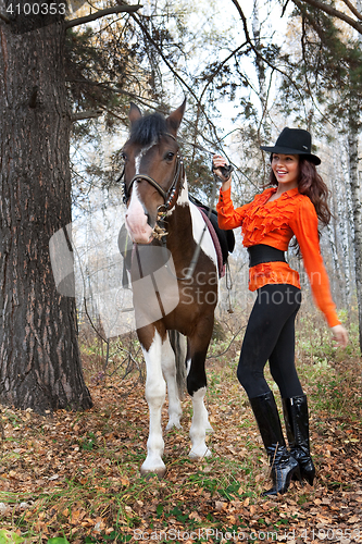 Image of Young Woman And Horse