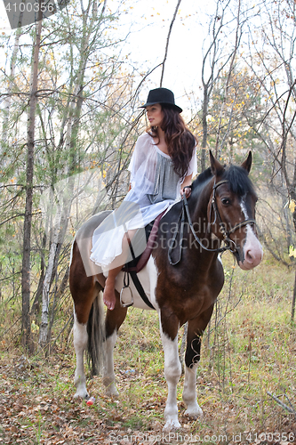 Image of Young Woman And Horse